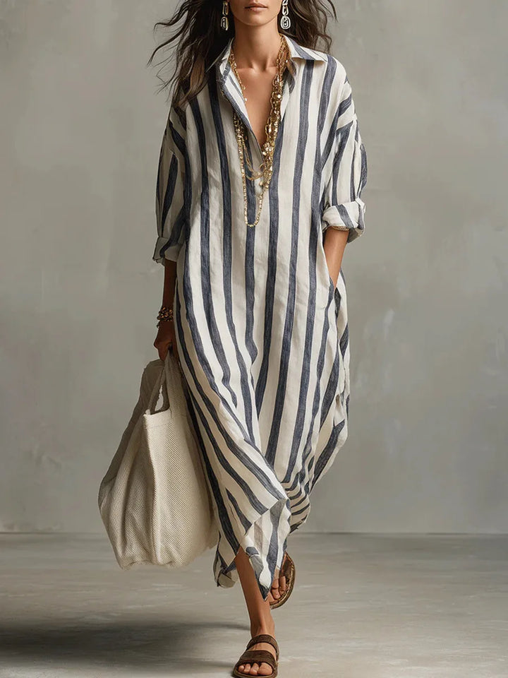 Women's striped maxi shirt dress with practical pockets, ideal for a relaxed summer or travel look.