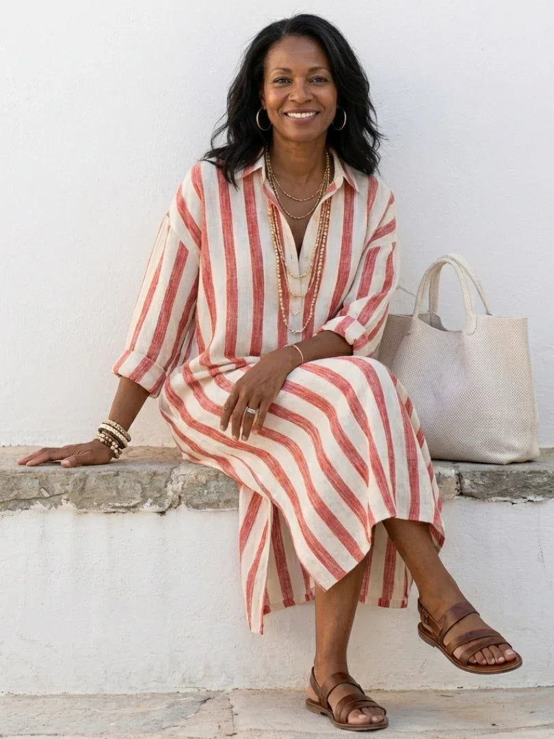 Effortless women's striped midi shirt dress with long sleeves, offering a relaxed fit & button detail.
