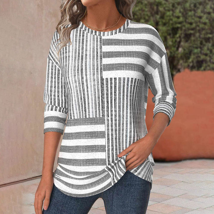 Women's striped short sleeve blouse in a relaxed fit for casual everyday style, perfect for spring and summer.
