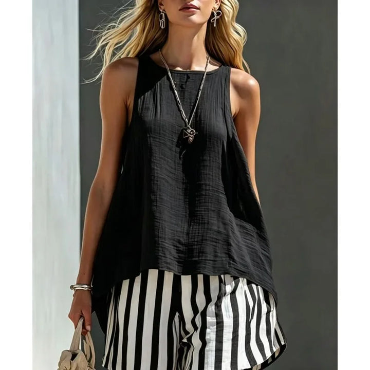 Women's striped sleeveless tank & shorts summer outfit. Casual and comfortable two-piece set for warm weather.