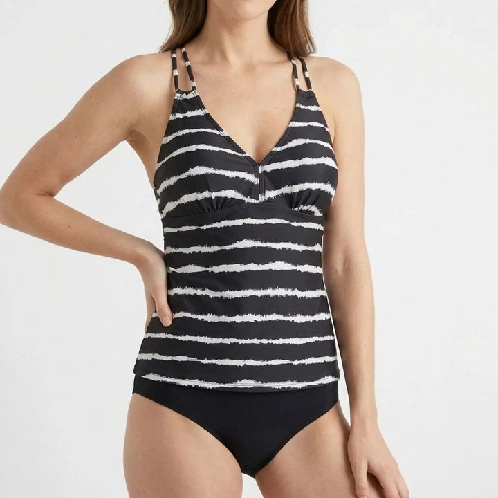 Women's striped tankini set: adjustable top & low-rise bikini bottoms. Versatile two-piece beachwear for summer fashion.