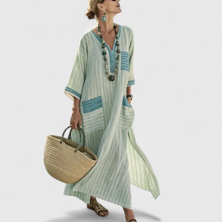 Women's striped V-neck maxi dress with convenient side pockets, perfect for a comfortable summer look.