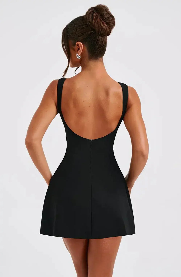 Modern sleeveless fit & flare mini dress with boat neck. Perfect women's fashion for elegant events.