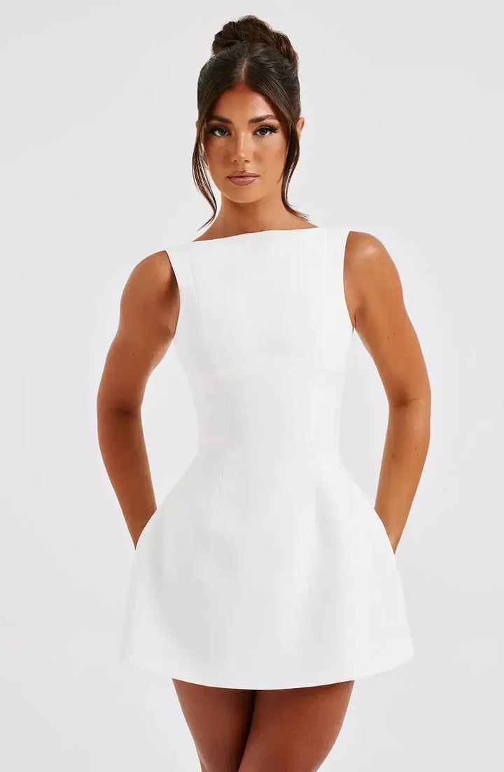 Solid color women's structured boat neck mini dress. A versatile fit & flare style for party fashion.