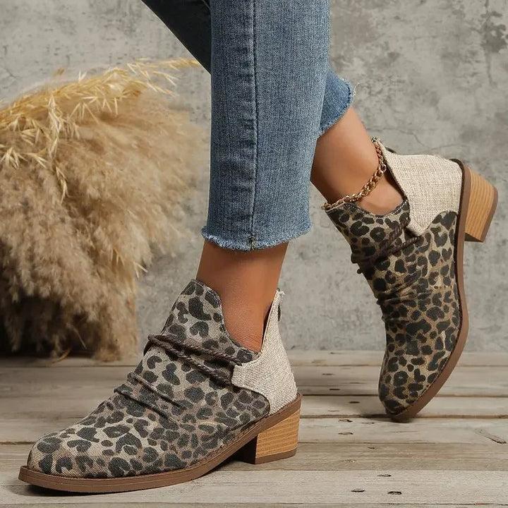 Elegant women's ankle boots, braided design, for a chic fashion statement. Comfortable & stylish.