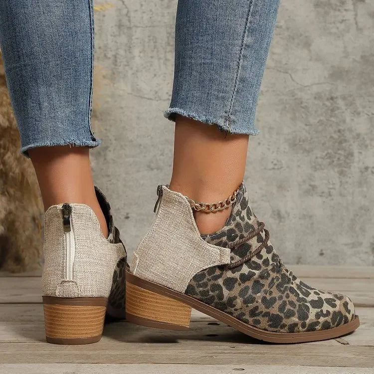 Denim blue ankle boots for women, featuring a block heel & braided detail. Stylish winter footwear.
