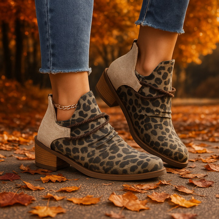 Leopard print women's ankle boots with elegant braided detail. Trendy and comfortable fashion footwear.