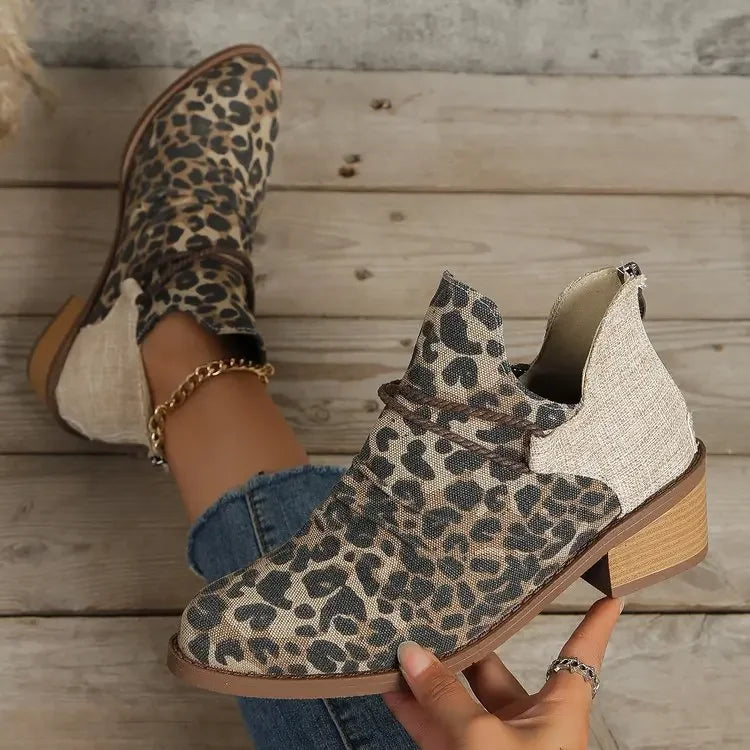 Stylish women's ankle boots, versatile denim blue, with elegant braided pattern. Modern footwear.