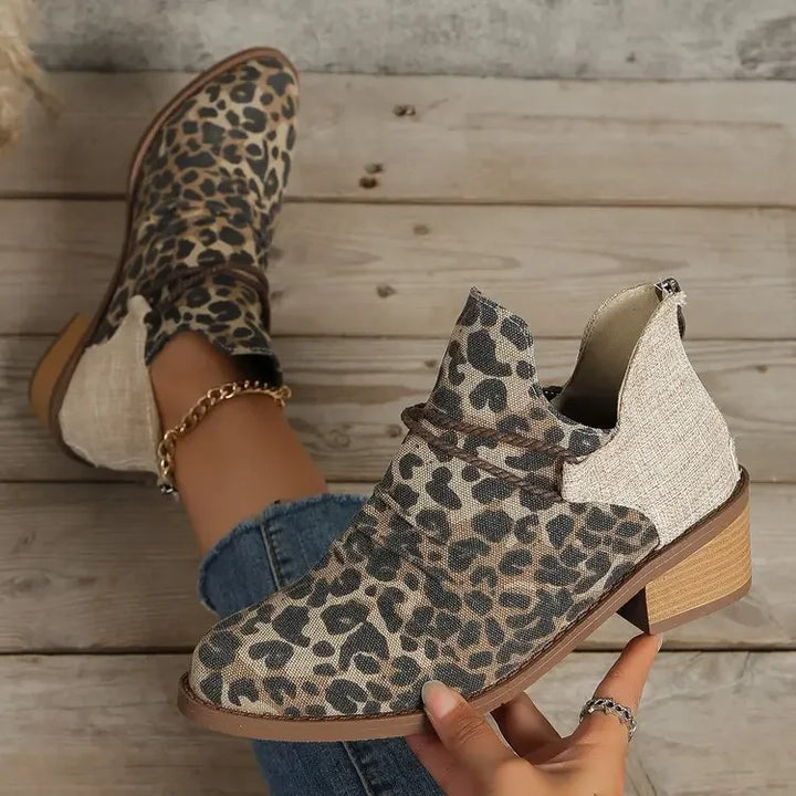 Stylish women's ankle boots, versatile denim blue, with elegant braided pattern. Modern footwear.