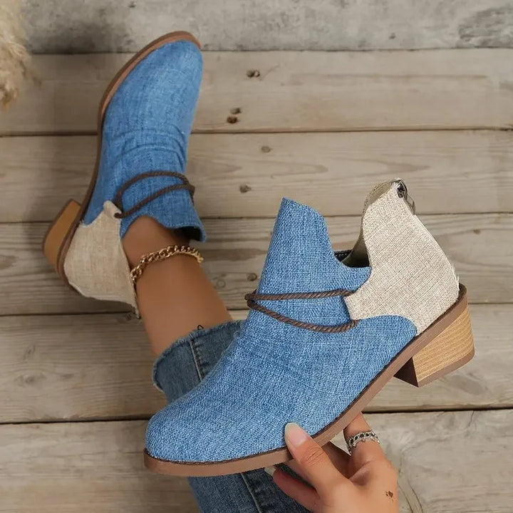 Close-up of braided and lace-wrap detail on women's fashionable ankle boots. High-quality design.