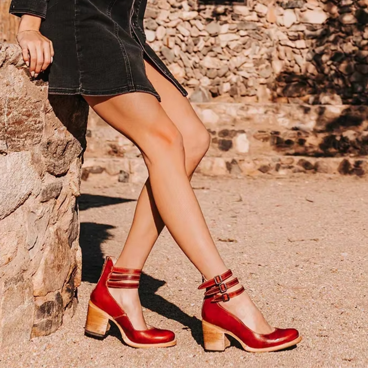 Women's stylish ankle strap block heel pumps with a comfortable round toe design.