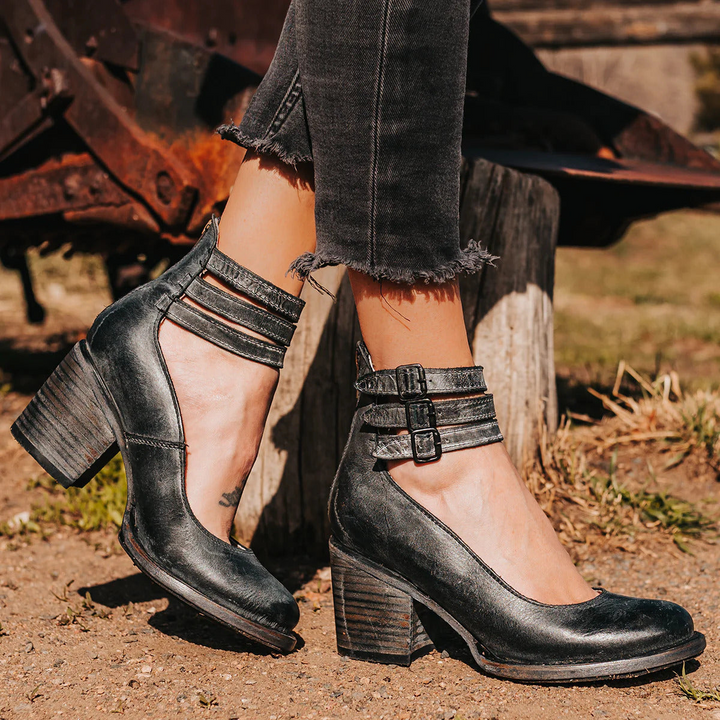 Versatile women's block heel pumps with ankle strap and round toe, ideal for work or events.