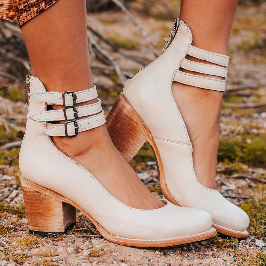 Women's round toe block heel pumps with ankle strap for a classic, stylish look.