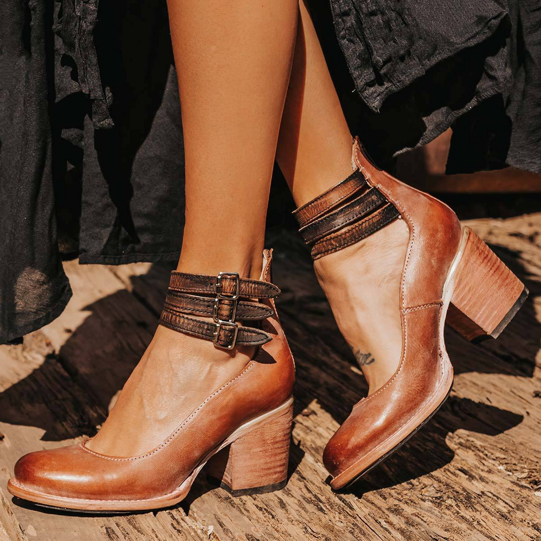 Stylish women's pumps: round toe, comfortable block heel, and secure ankle strap design.