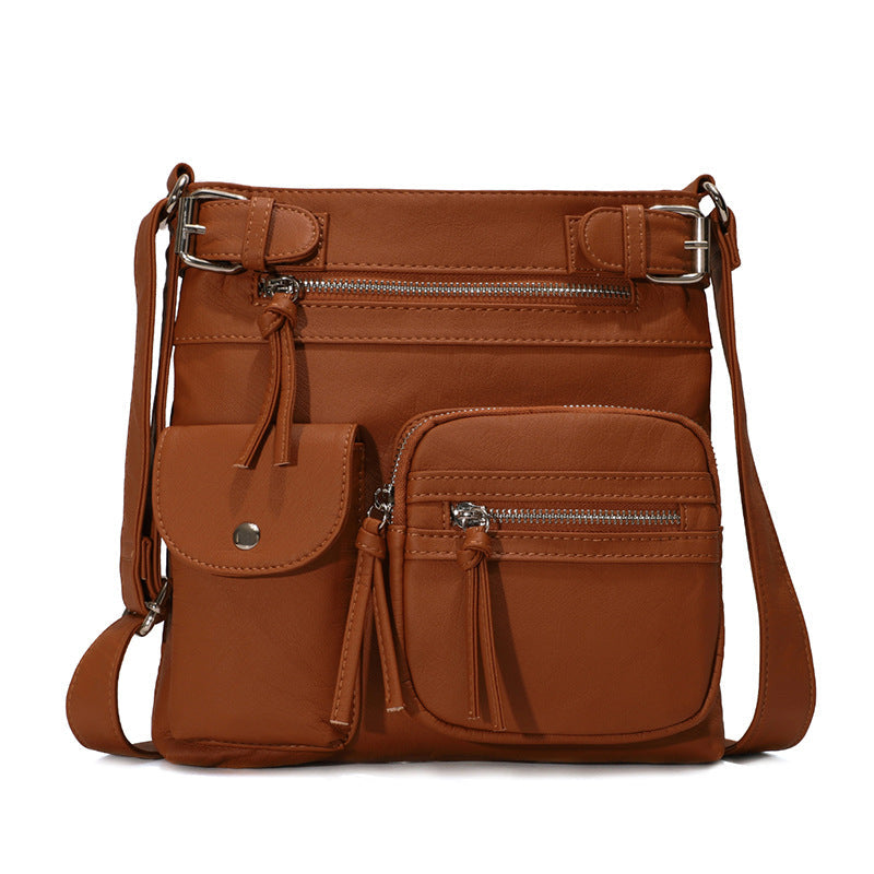 Organized women's anti-theft messenger bag, showing interior pockets & secure closures.