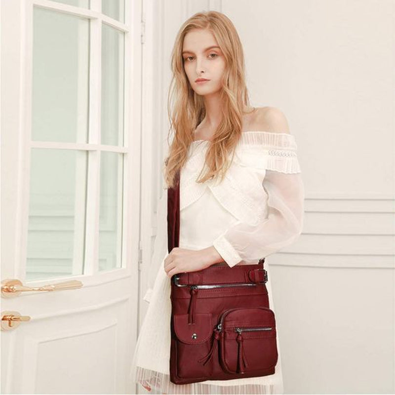 Secure women's crossbody travel bag with multiple compartments for organized storage.