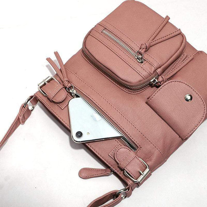 Modern women's anti-theft travel bag, worn cross-body, showcasing its secure features.