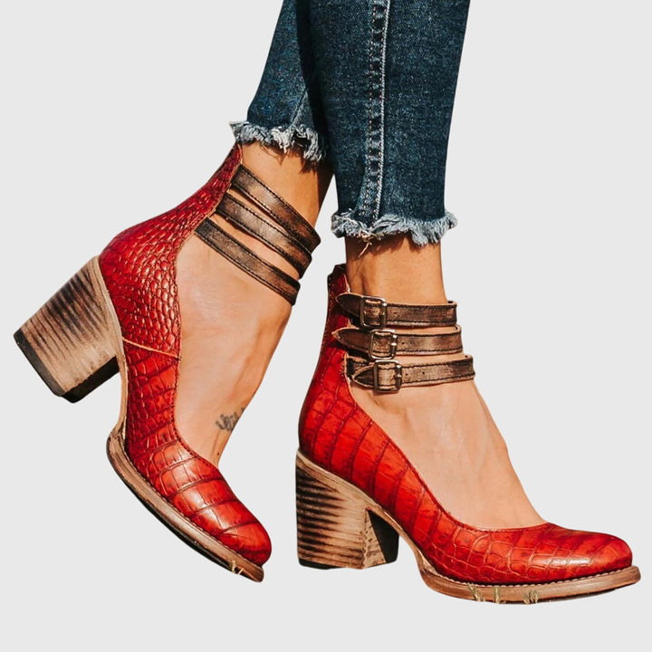 Trendy women's casual ankle boots, black, with a comfortable block heel, buckle straps, and cool cutout details.