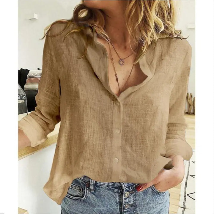 Women's elegant button-up blouse with V-neck, rolled sleeves & loose fit. A versatile top for casual & workwear.