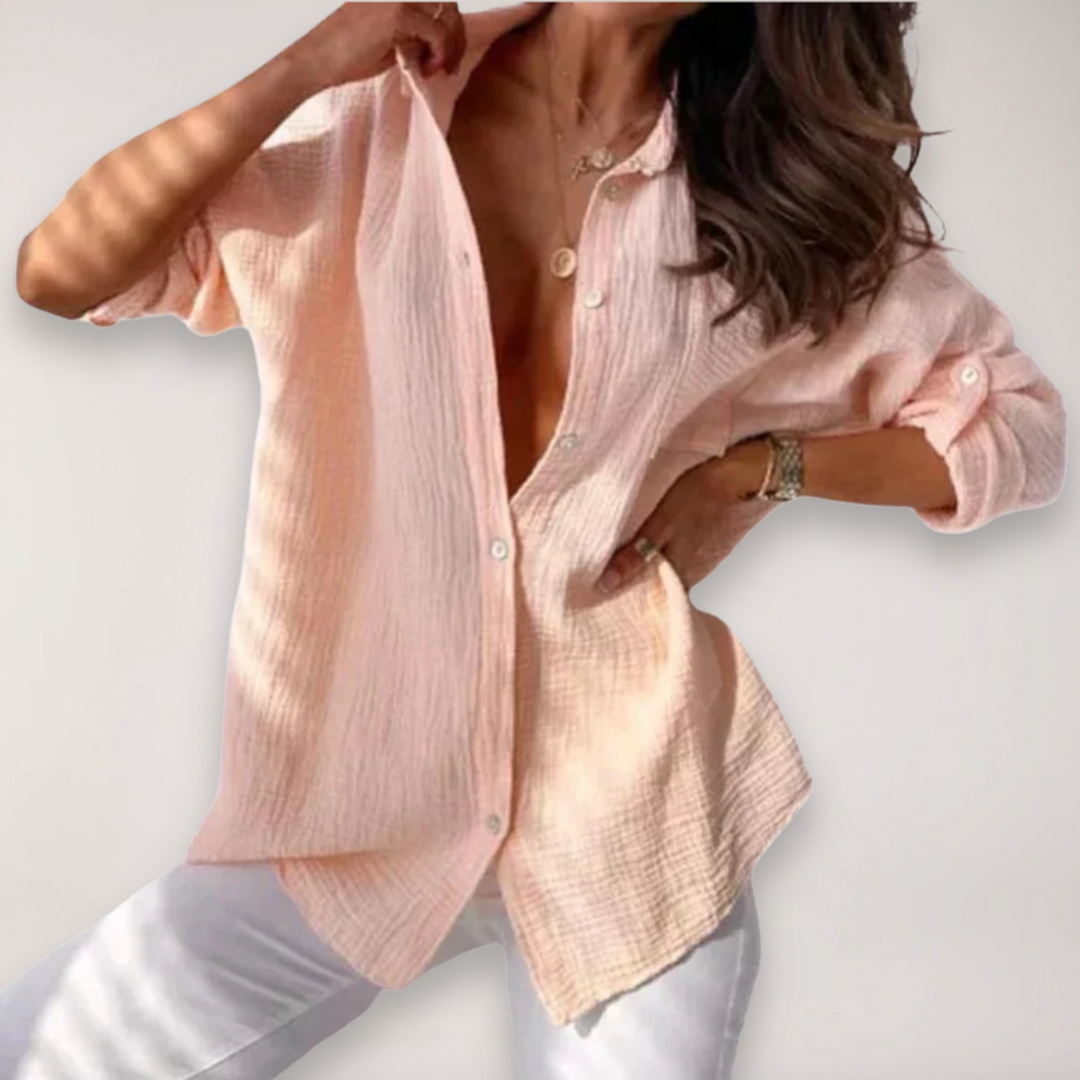 Women's stylish button-up blouse with versatile roll-up sleeves, perfect for casual or office wear.