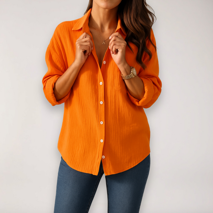 Comfortable women's button blouse with roll-up sleeves, an everyday fashion essential for versatile styling.