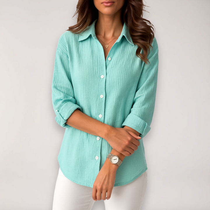 Elegant women's button blouse with roll-up sleeves, a stylish top for women seeking versatile and chic apparel.