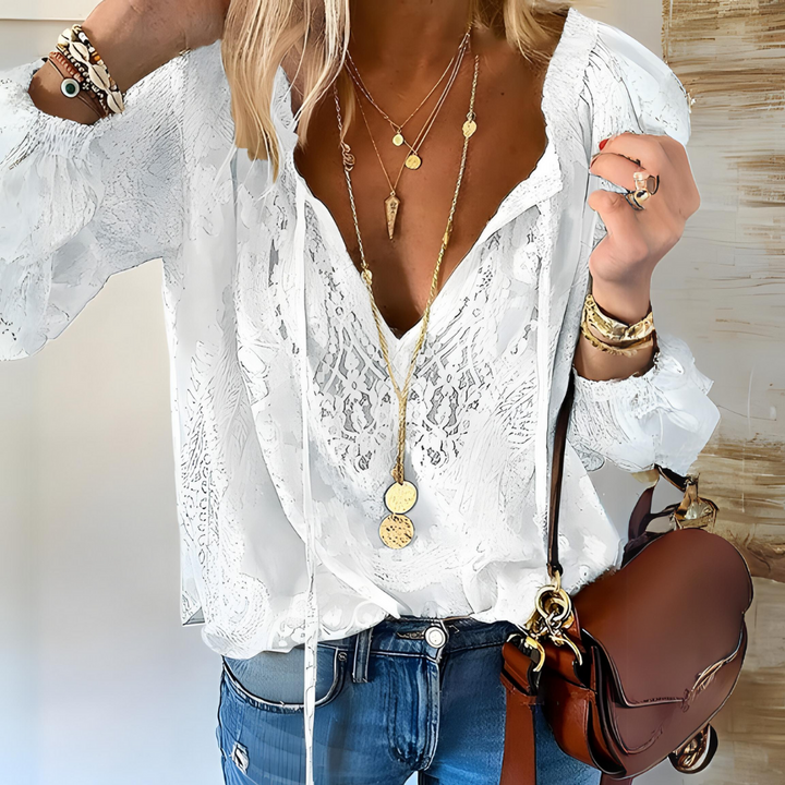 Fashionable women's crocheted boho blouse, a breathable summer top with long sleeves. Perfect for bohemian style.