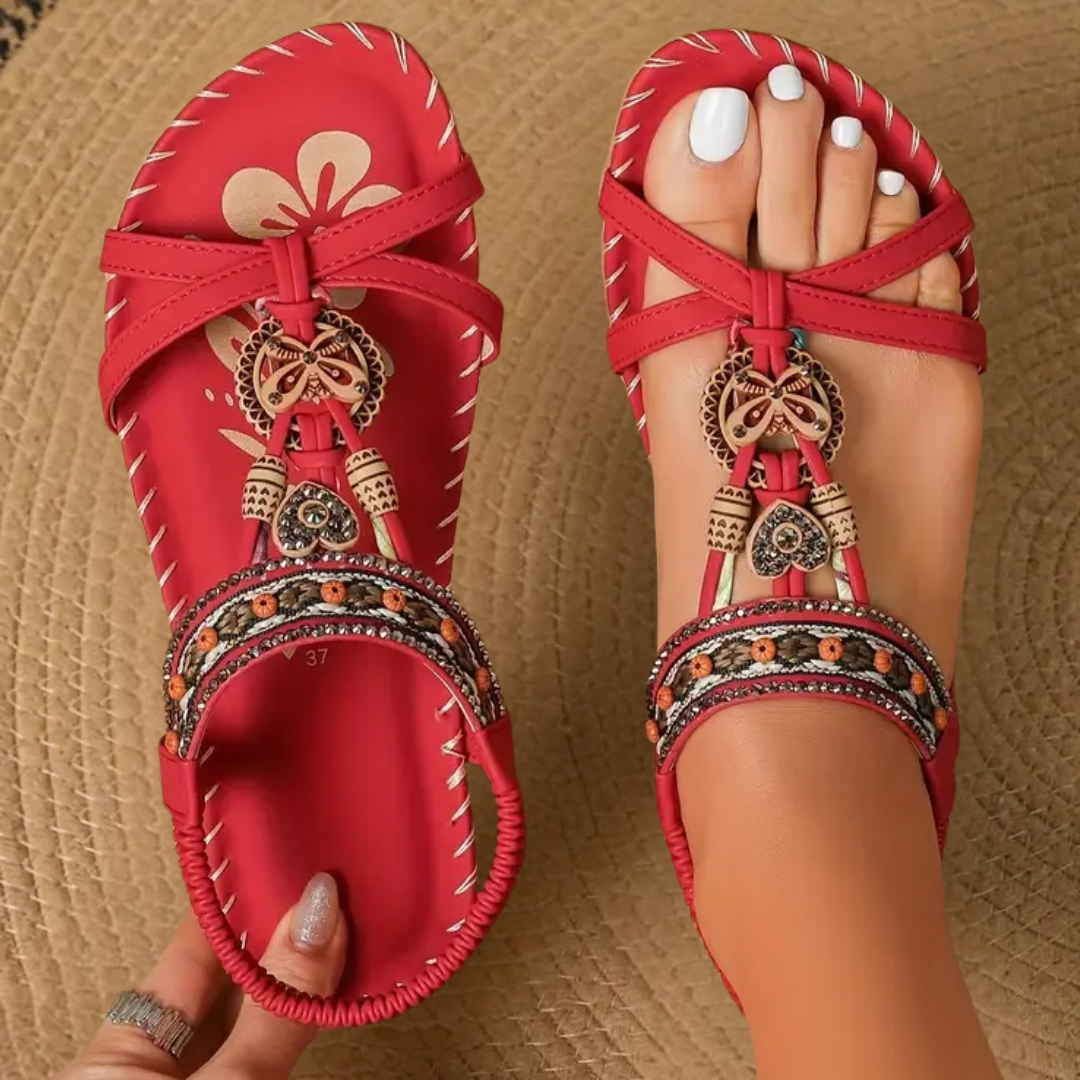 Elegant women's flat T-strap sandals with open toe for casual everyday comfort.