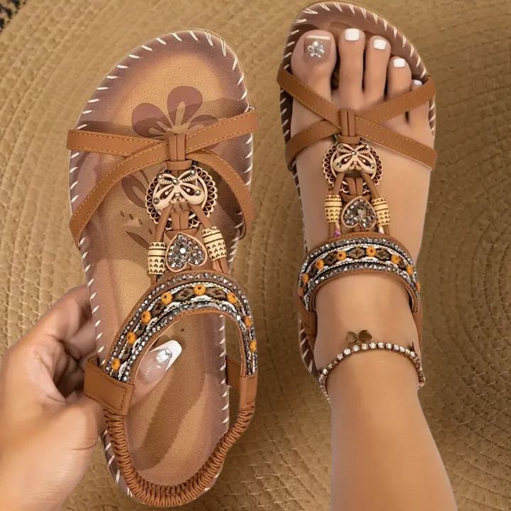 Lightweight women's flat T-strap sandals, offering stylish comfort for everyday wear.