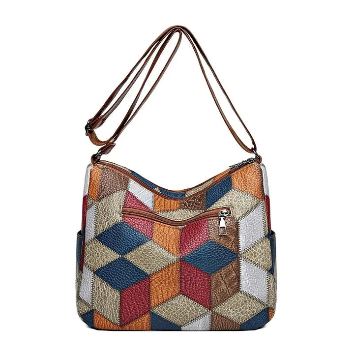 Detailed geometric patchwork shoulder bag for women. Fashion-forward vegan leather purse.