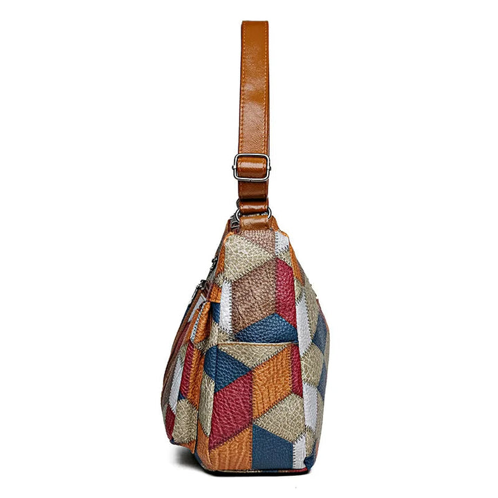 Chic women's geometric patchwork vegan leather handbag. Perfect stylish accessory.