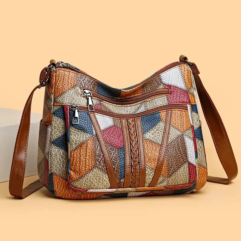 Fashionable women's patchwork purse with modern geometric design. Stylish accessory.