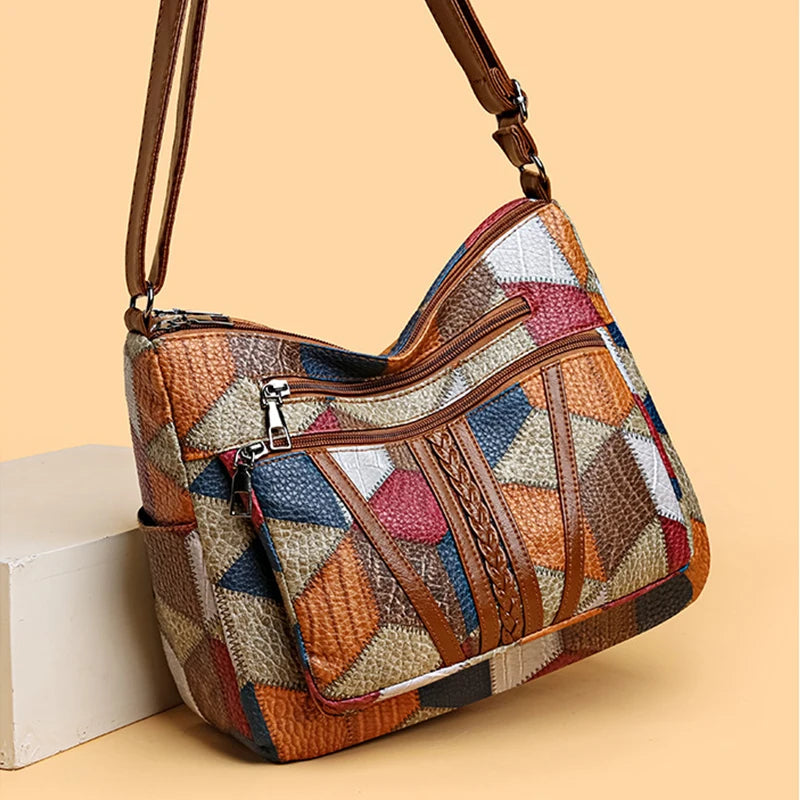 Stylish geometric patchwork shoulder bag for women. Elegant vegan leather handbag.