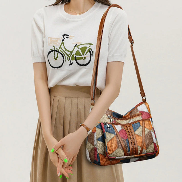 Modern geometric patchwork women's shoulder bag. Stylish vegan leather purse.