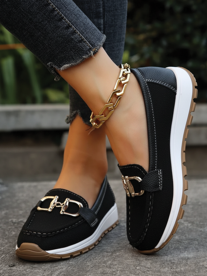 Chic yellow women's flat buckle loafers, providing everyday comfort. Easy slip-on casual and elegant footwear.