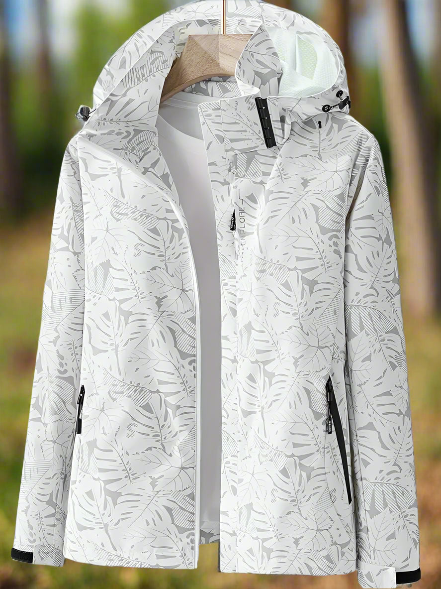 Fashionable women's lightweight rain jacket for outdoor adventures. Waterproof & wind resistant, elegant leaf design.