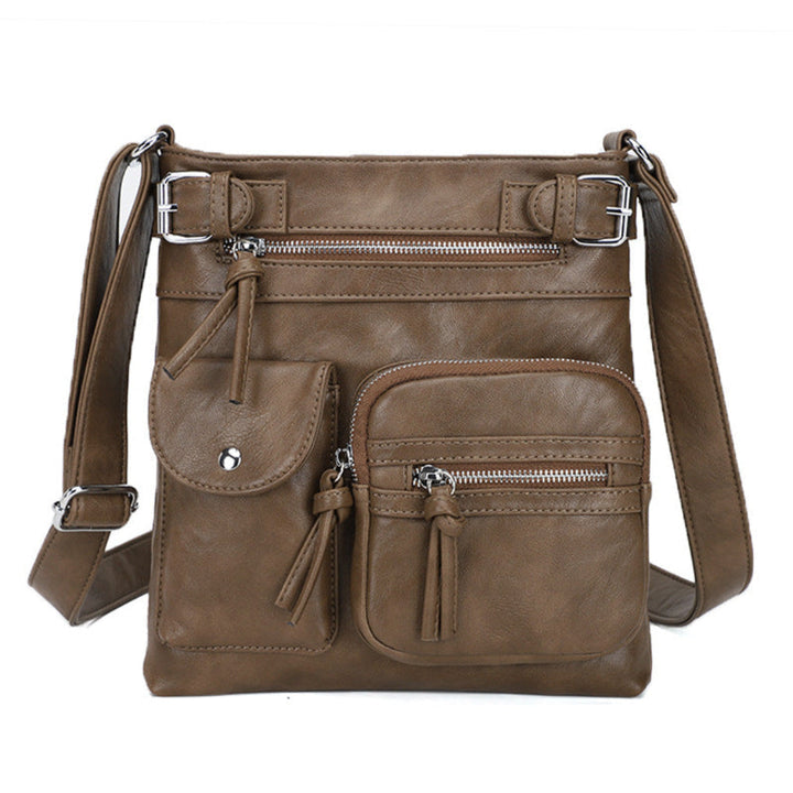 Stylish women's everyday bag in light brown, multi-pocket crossbody for convenient organization.