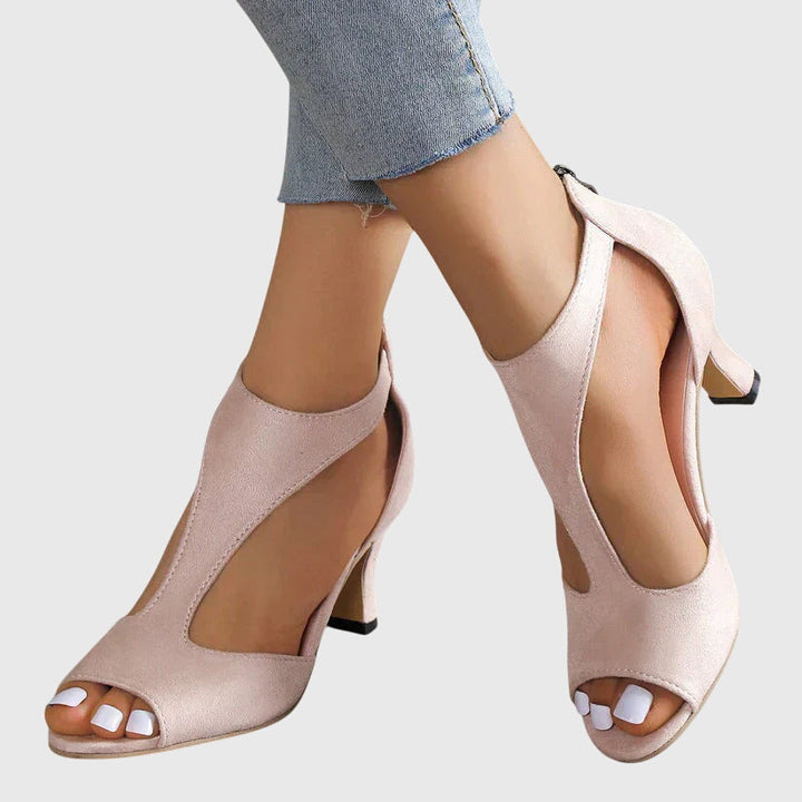 Women's stylish pink cut-out peep toe block heel sandals, elegant & comfortable for any occasion.