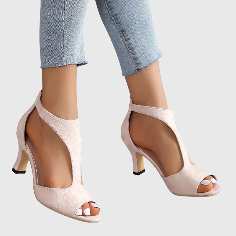 Chic black women's sandals with cut-out details, peep toe, & stable block heel for versatile styling.