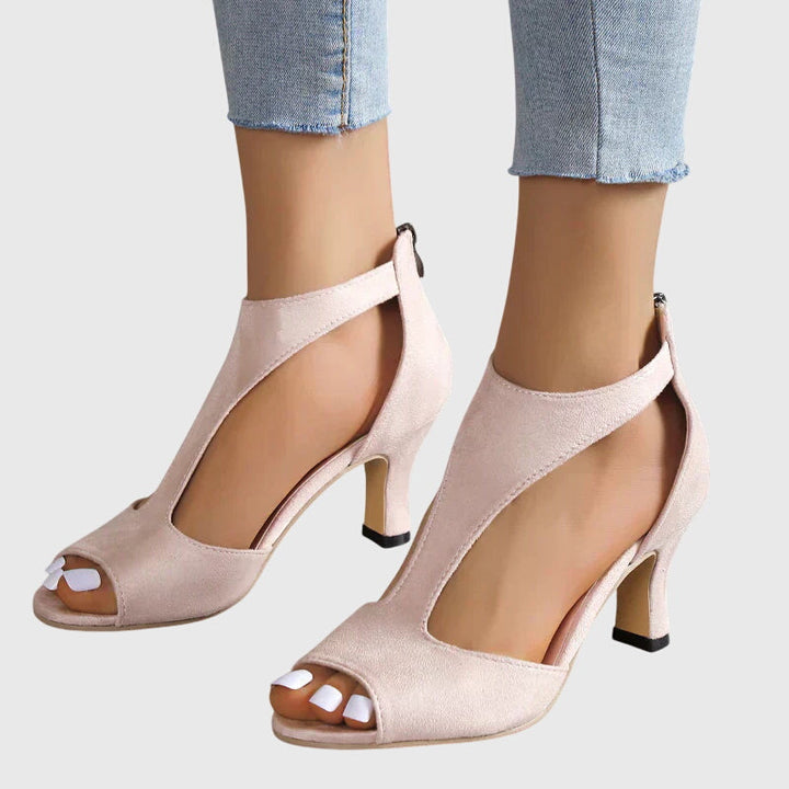 Formal black block heel sandals with stylish cut-outs & peep toe, perfect for evening wear & comfort.