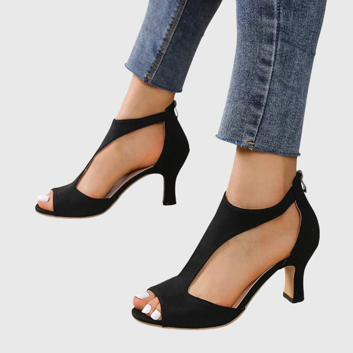 Elegant pink cut-out peep toe sandals for women, designed with a comfortable and chic block heel.