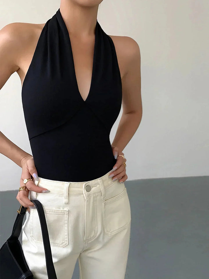 Women's stylish sleeveless halter top with crossover V-neck. Perfect for summer fashion & casual wear.
