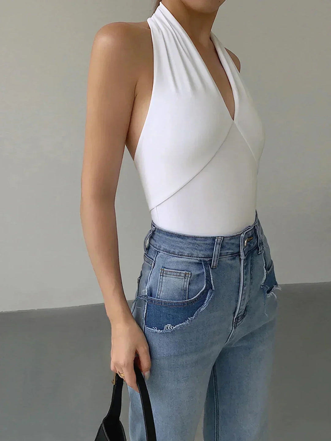 Slim fit women's halter top, sleeveless with a flattering crossover V-neck. Perfect for summer & casual fashion.