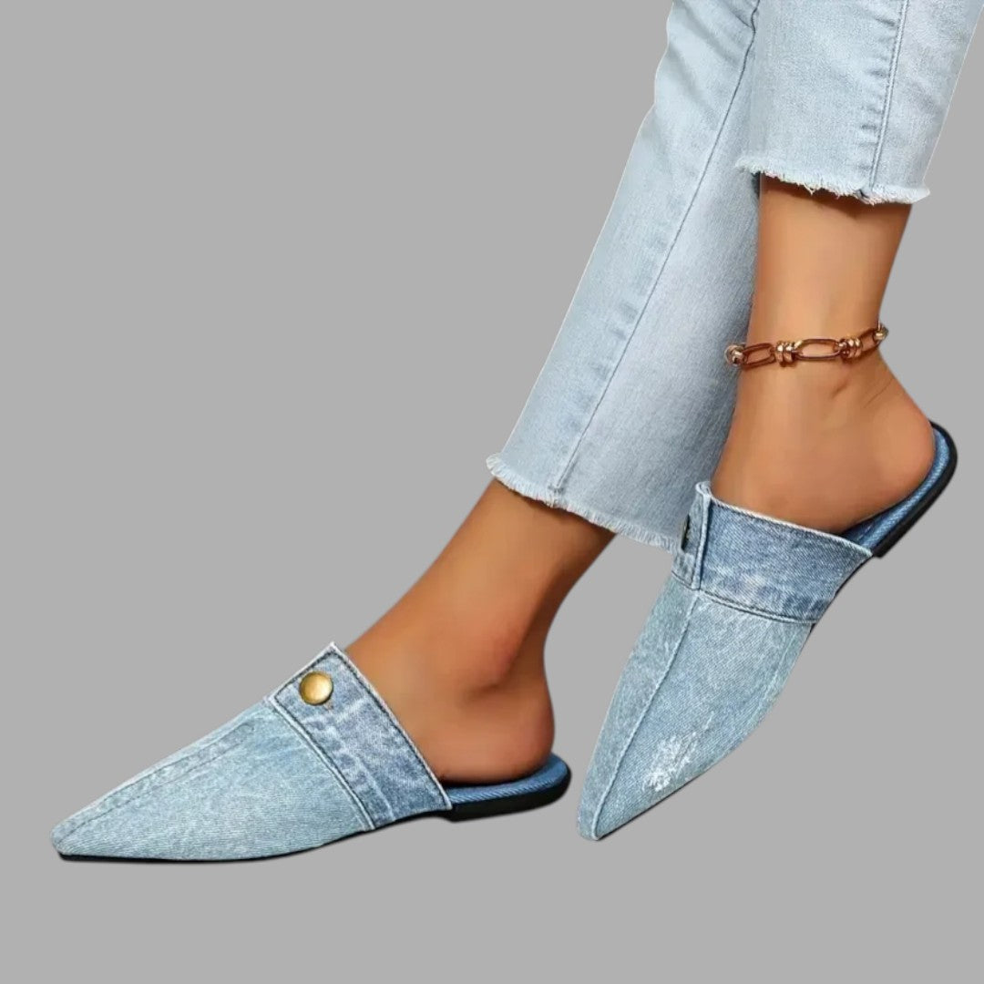 Women's stylish slip-on mule sandals in a neutral tone, offering casual comfort and everyday style for summer.