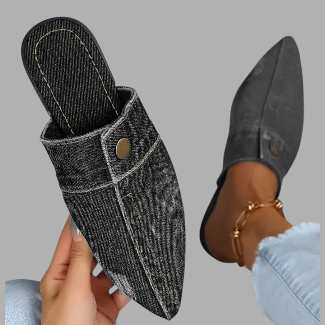 Chic women's open-back slip-on mule sandals with a flat sole, perfect for comfortable casual summer wear.