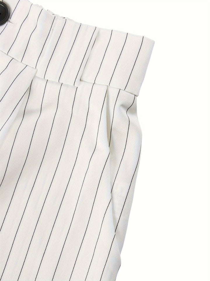 Modern striped women's summer outfit. Lightweight blazer and shorts set, ideal for a chic and comfortable look.
