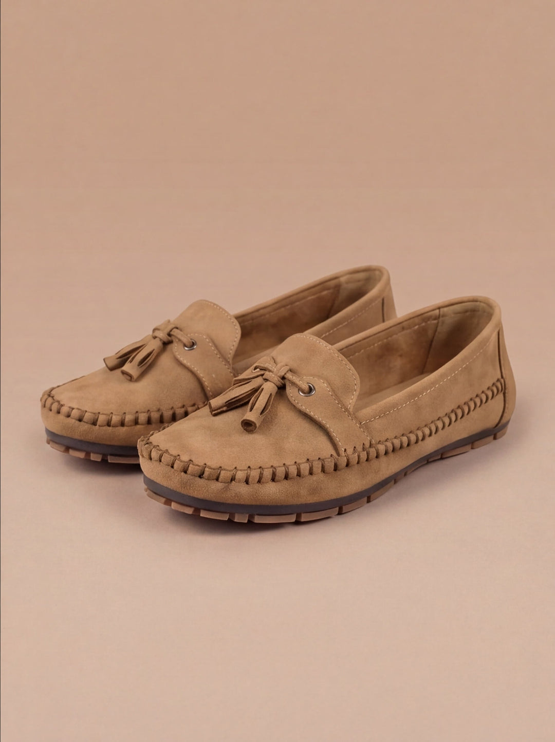 Chic women's tassel moccasin loafers, comfortable casual flats enhancing any everyday fashion.