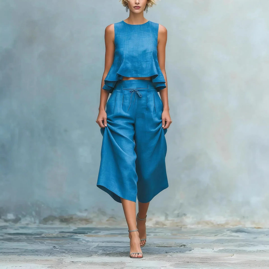 Women's stylish two-piece crop top and wide-leg pant set, perfect for summer fashion or resort wear.