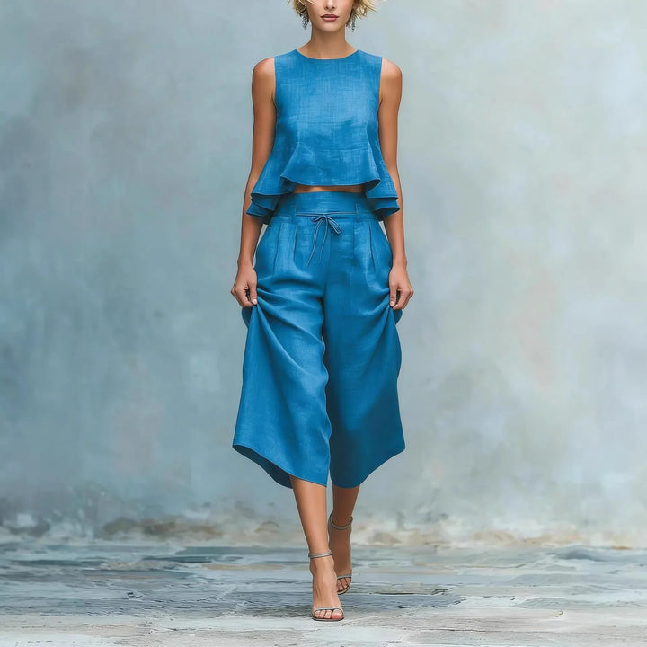 Women's stylish two-piece crop top and wide-leg pant set, perfect for summer fashion or resort wear.