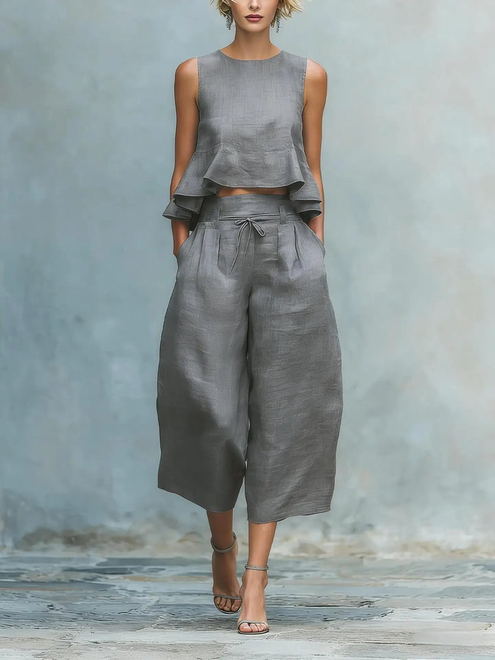 Modern women's matching crop top and wide-leg pant set, a chic and comfortable two-piece outfit for summer.